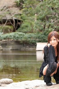 a beautiful woman in a bath suit on her knees