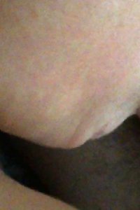 an asian girl has her ass fucked and is being fed by two men